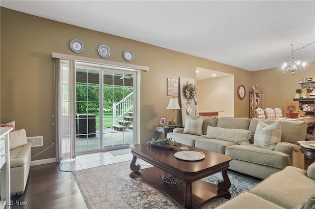 5461 Brook Run Ave NE, Louisville, OH 44641 - living area featuring a chandelier and wood finished floors