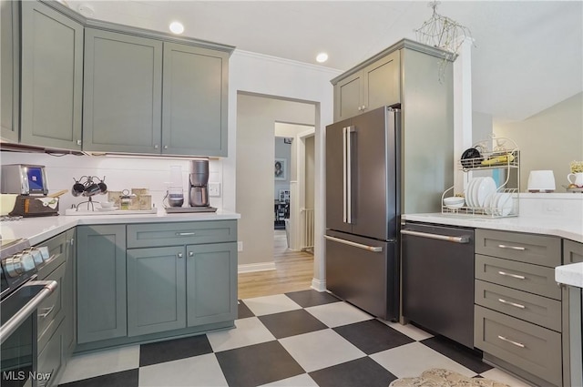 5461 Brook Run Ave NE, Louisville, OH 44641 - kitchen featuring appliances with stainless steel finishes, light floors, light countertops, and crown molding