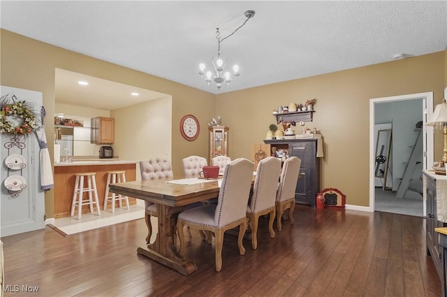 5461 Brook Run Ave NE, Louisville, OH 44641 - dining area with dark wood-style floors, a chandelier, and recessed lighting