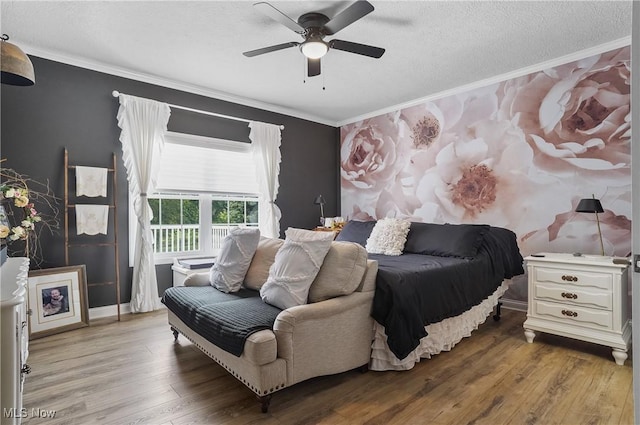 5461 Brook Run Ave NE, Louisville, OH 44641 - bedroom with wood finished floors, ornamental molding, a textured ceiling, and ceiling fan