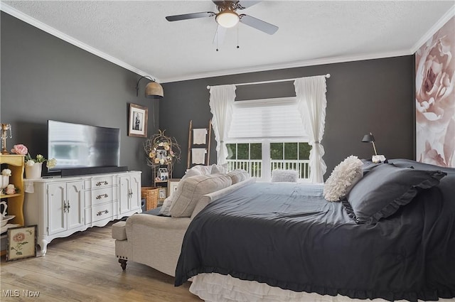 5461 Brook Run Ave NE, Louisville, OH 44641 - bedroom featuring ornamental molding, wood finished floors, a textured ceiling, and a ceiling fan
