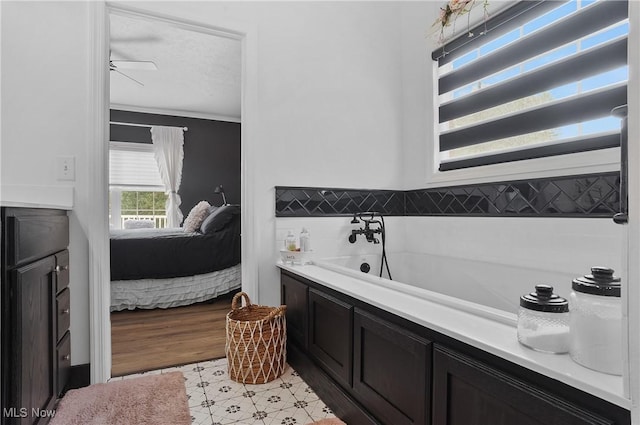 5461 Brook Run Ave NE, Louisville, OH 44641 - full bathroom featuring ensuite bath, a bath, and ornamental molding
