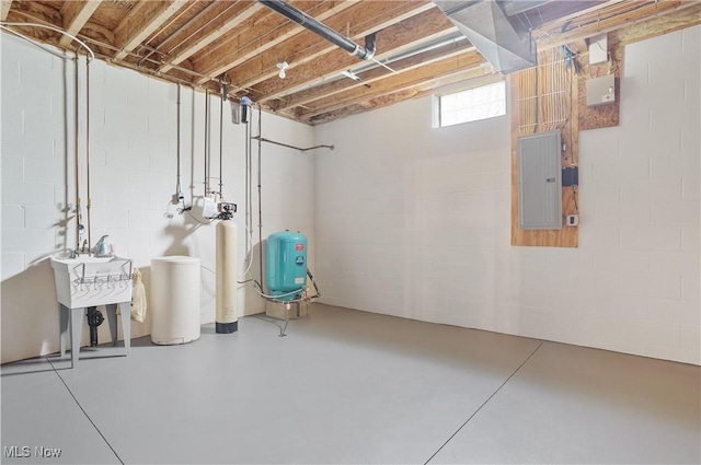 5461 Brook Run Ave NE, Louisville, OH 44641 - below grade area featuring electric panel, a water pressure tank, a water softener, and concrete block wall