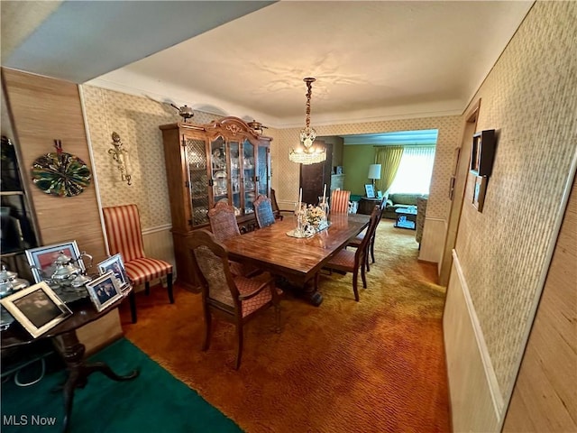 130 E 199th St, Euclid, OH 44119 - carpeted dining space with wallpapered walls and a chandelier