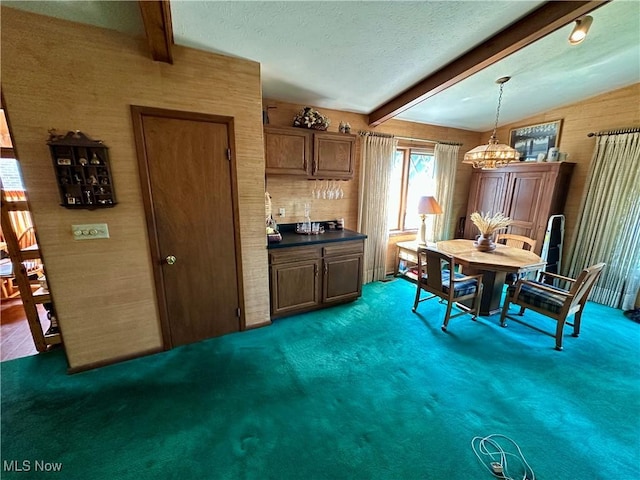 130 E 199th St, Euclid, OH 44119 - carpeted dining space featuring beam ceiling, a chandelier, and a textured ceiling