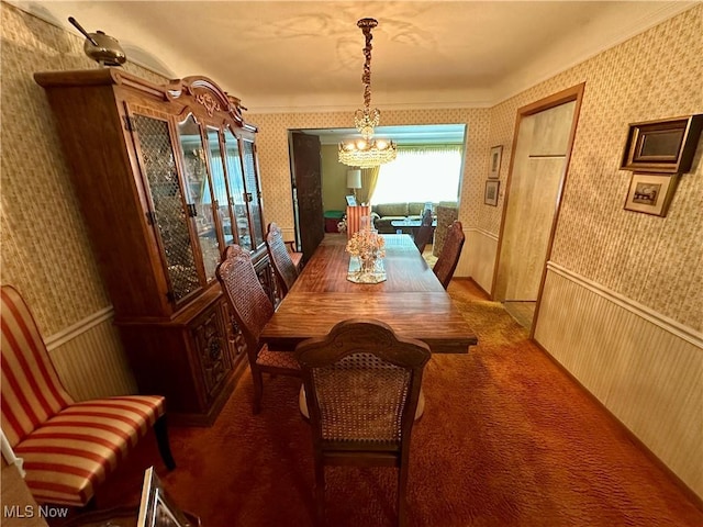 130 E 199th St, Euclid, OH 44119 - carpeted dining room featuring wallpapered walls, a chandelier, wainscoting, and crown molding