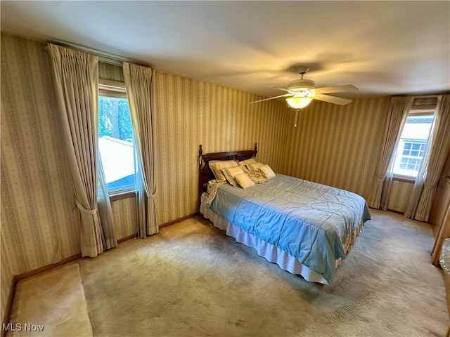 130 E 199th St, Euclid, OH 44119 - bedroom featuring wallpapered walls, light colored carpet, and a ceiling fan