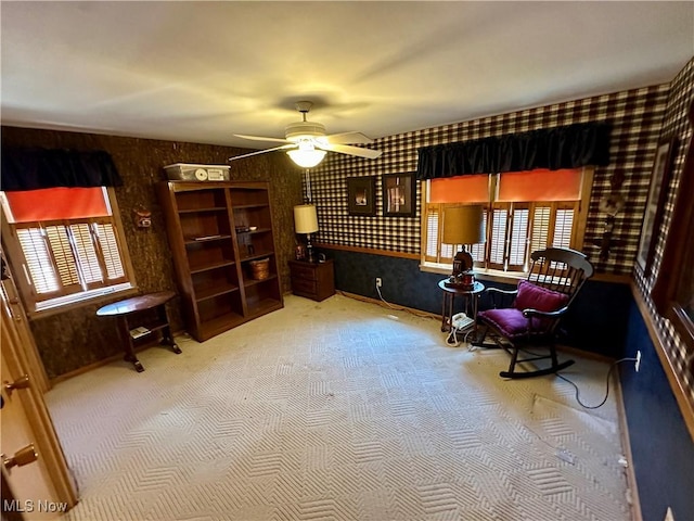 130 E 199th St, Euclid, OH 44119 - living area with wallpapered walls, carpet floors, and a ceiling fan