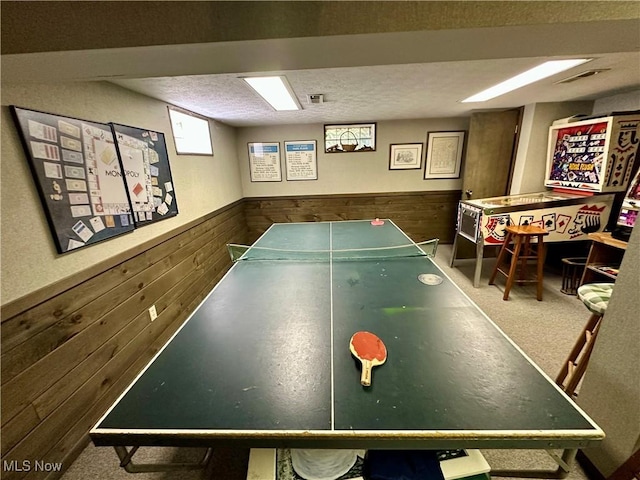 130 E 199th St, Euclid, OH 44119 - game room featuring wooden walls, wainscoting, and a textured ceiling