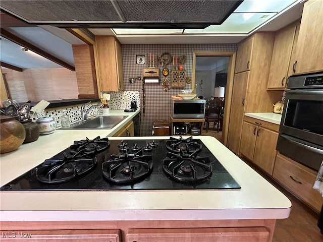 130 E 199th St, Euclid, OH 44119 - kitchen featuring stainless steel appliances, light countertops, a warming drawer, and brown cabinetry