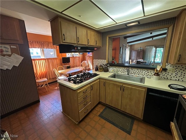 130 E 199th St, Euclid, OH 44119 - kitchen with gas stovetop, under cabinet range hood, a peninsula, and light countertops