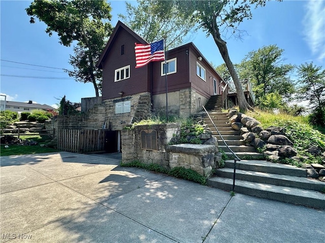 130 E 199th St, Euclid, OH 44119 - view of front of home with stairs and stone siding