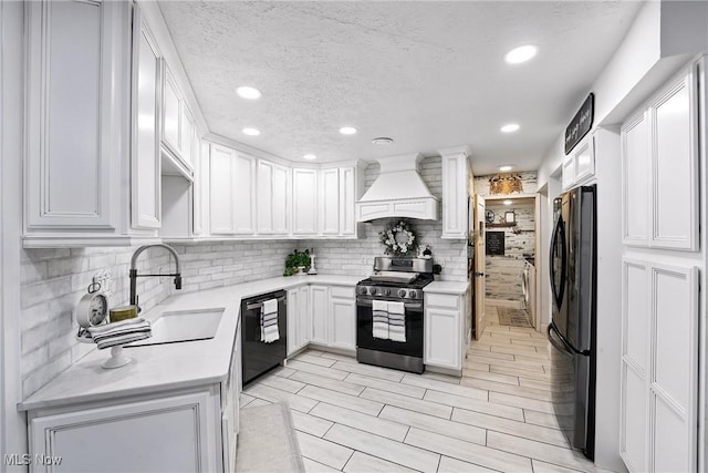 1293 Redtail Hawk Dr Unit 4, Boardman, OH 44512 - kitchen with gas range, custom range hood, dishwasher, freestanding refrigerator, and backsplash