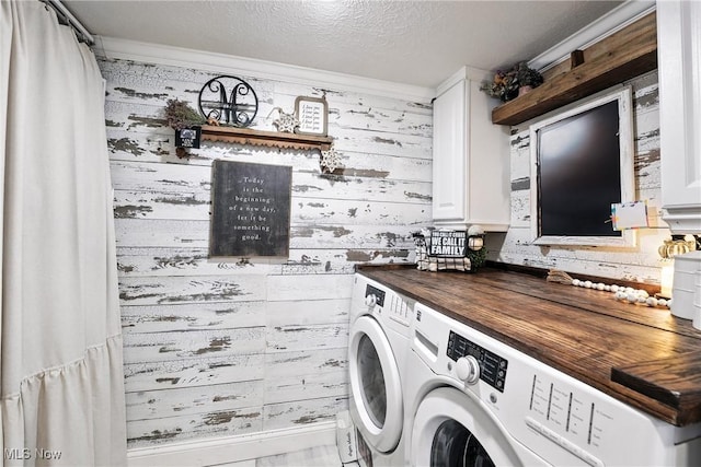 1293 Redtail Hawk Dr Unit 4, Boardman, OH 44512 - laundry area with washing machine and clothes dryer, wooden walls, cabinet space, and a textured ceiling