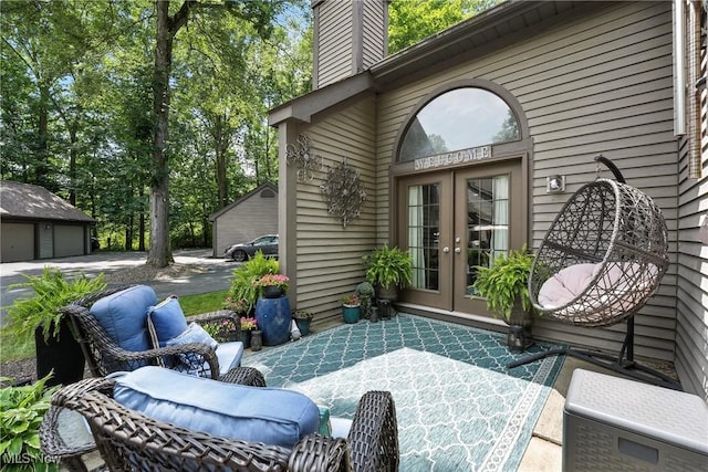 1293 Redtail Hawk Dr Unit 4, Boardman, OH 44512 - view of patio featuring french doors and a detached garage
