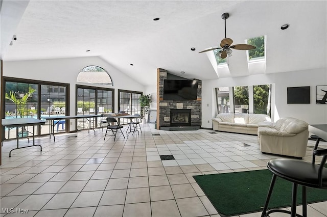 1293 Redtail Hawk Dr Unit 4, Boardman, OH 44512 - living area featuring ceiling fan, plenty of natural light, high vaulted ceiling, a fireplace, and light tile patterned flooring