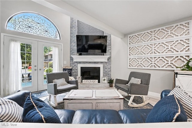1293 Redtail Hawk Dr Unit 4, Boardman, OH 44512 - living room with french doors, a fireplace, and wood finished floors