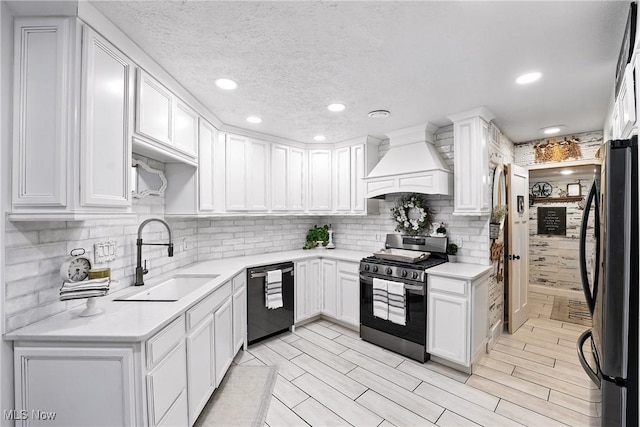 1293 Redtail Hawk Dr Unit 4, Boardman, OH 44512 - kitchen with appliances with stainless steel finishes, custom exhaust hood, backsplash, white cabinetry, and recessed lighting