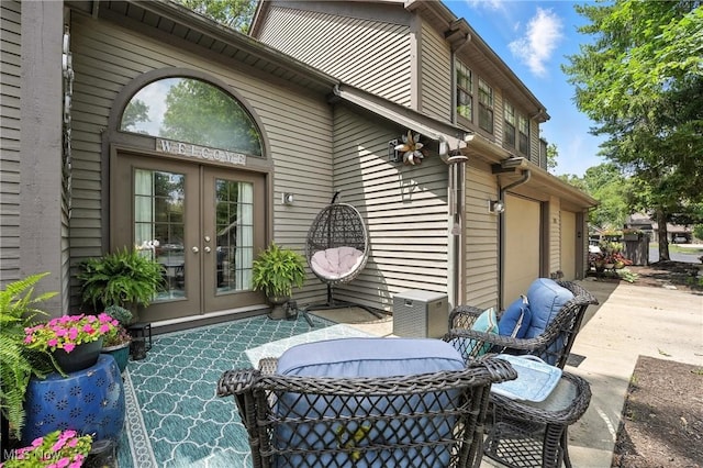 1293 Redtail Hawk Dr Unit 4, Boardman, OH 44512 - view of patio with french doors, driveway, and an attached garage