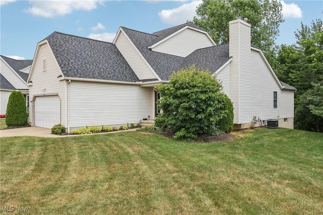 957 Devonwood Dr, Wadsworth, OH 44281 - view of property exterior with roof with shingles, a garage, a chimney, concrete driveway, and a yard