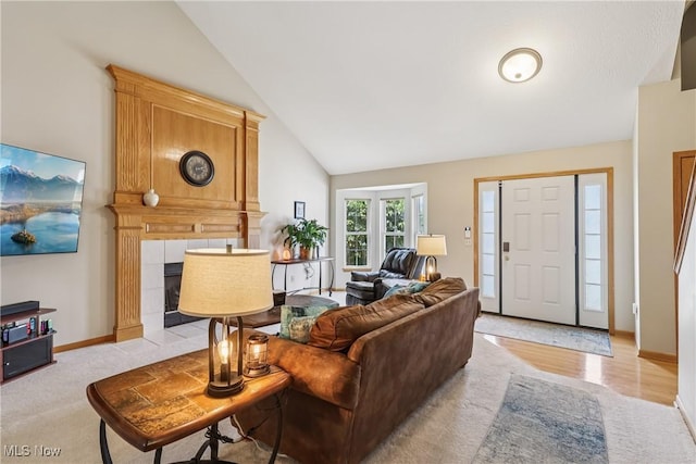 957 Devonwood Dr, Wadsworth, OH 44281 - living area with a fireplace, high vaulted ceiling, and light carpet