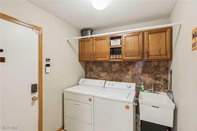 957 Devonwood Dr, Wadsworth, OH 44281 - laundry room featuring cabinet space, washer and clothes dryer, and a textured ceiling