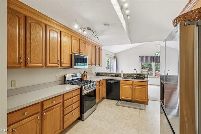957 Devonwood Dr, Wadsworth, OH 44281 - kitchen with appliances with stainless steel finishes, brown cabinets, light countertops, light tile patterned flooring, and vaulted ceiling