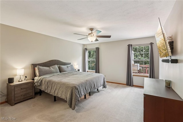 957 Devonwood Dr, Wadsworth, OH 44281 - bedroom featuring multiple windows, light colored carpet, and a ceiling fan