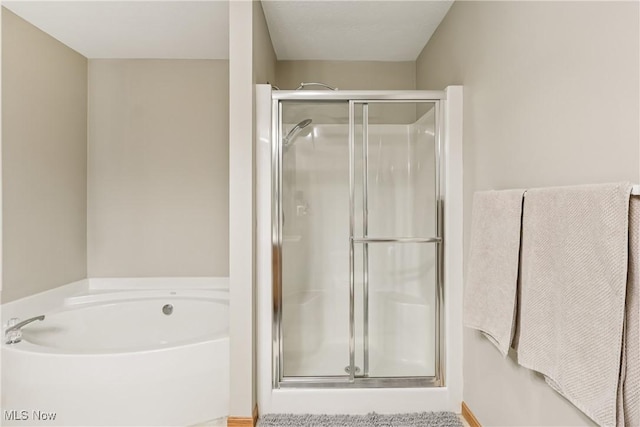 957 Devonwood Dr, Wadsworth, OH 44281 - bathroom with a stall shower and a garden tub