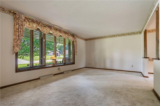 5200 Tanglewood Ave NE, Louisville, OH 44641 - carpeted empty room featuring baseboards
