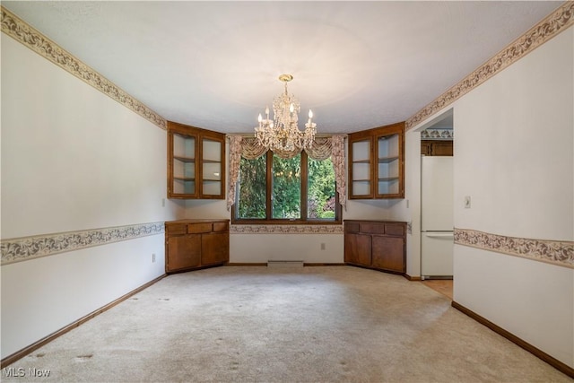 5200 Tanglewood Ave NE, Louisville, OH 44641 - unfurnished dining area with a chandelier and light carpet
