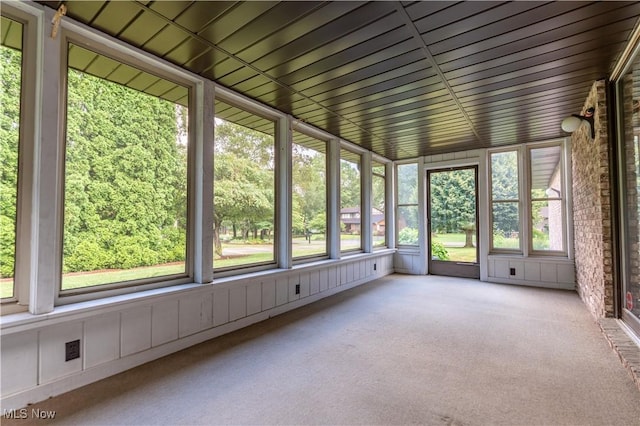 5200 Tanglewood Ave NE, Louisville, OH 44641 - unfurnished sunroom featuring carpet flooring