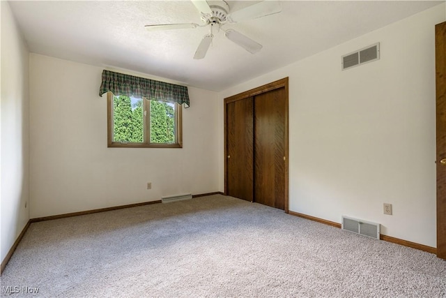 5200 Tanglewood Ave NE, Louisville, OH 44641 - unfurnished bedroom with carpet, a closet, and ceiling fan