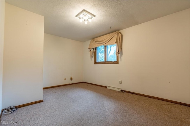 5200 Tanglewood Ave NE, Louisville, OH 44641 - carpeted empty room with baseboards and a textured ceiling