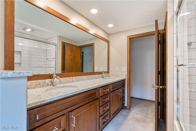5200 Tanglewood Ave NE, Louisville, OH 44641 - full bath featuring double vanity, a tile shower, recessed lighting, and tile patterned flooring