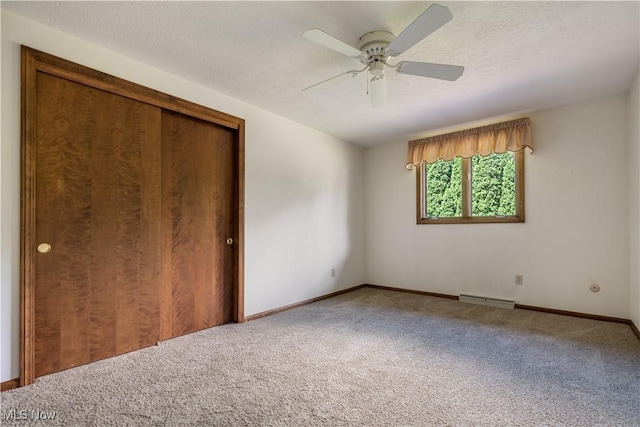 5200 Tanglewood Ave NE, Louisville, OH 44641 - unfurnished bedroom with carpet, a closet, and ceiling fan