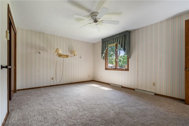 5200 Tanglewood Ave NE, Louisville, OH 44641 - unfurnished room featuring wallpapered walls, carpet floors, and a ceiling fan