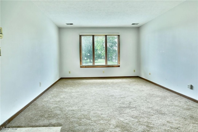 894 Pearson Cir Unit 3, Boardman, OH 44512 - carpeted empty room with baseboards and a textured ceiling