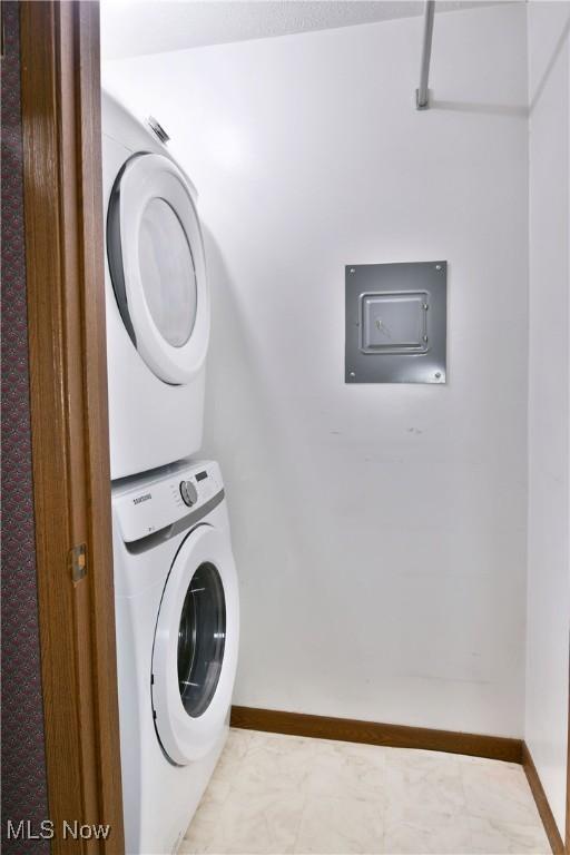 894 Pearson Cir Unit 3, Boardman, OH 44512 - washroom featuring stacked washer / dryer and baseboards