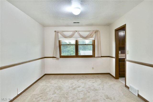894 Pearson Cir Unit 3, Boardman, OH 44512 - unfurnished room featuring carpet flooring and a wainscoted wall