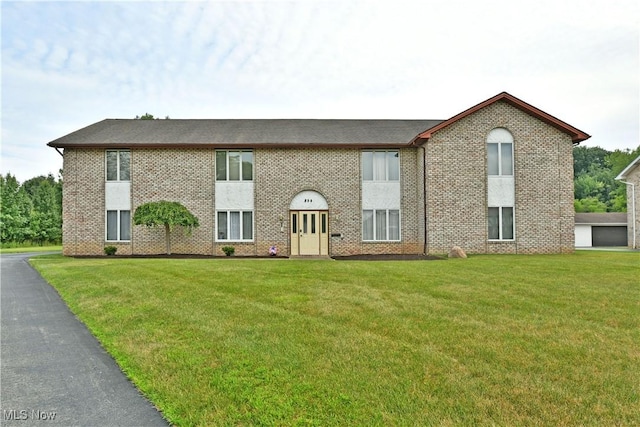 894 Pearson Cir Unit 3, Boardman, OH 44512 - view of front of property featuring brick siding, a front lawn, and a garage