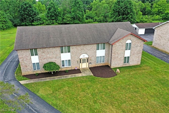 894 Pearson Cir Unit 3, Boardman, OH 44512 - view of front facade featuring brick siding, a front lawn, and roof with shingles