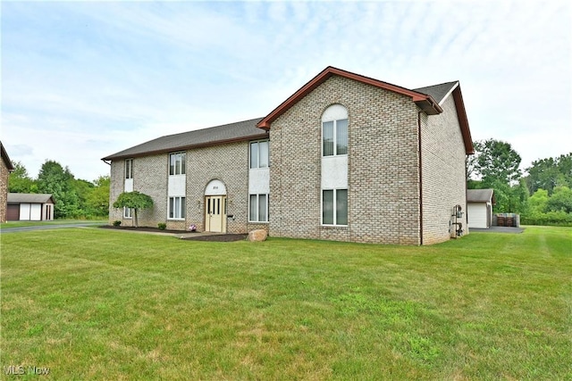 894 Pearson Cir Unit 3, Boardman, OH 44512 - rear view of house featuring a yard and brick siding
