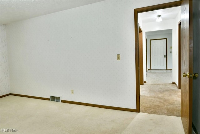894 Pearson Cir Unit 3, Boardman, OH 44512 - empty room featuring carpet and wallpapered walls