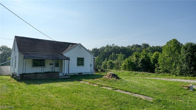 60 S Liberty St, New Concord, OH 43762 - view of front facade featuring a front yard and a porch