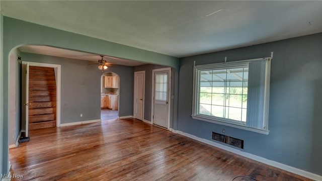 60 S Liberty St, New Concord, OH 43762 - unfurnished room featuring arched walkways, wood finished floors, and ceiling fan