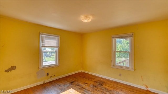 60 S Liberty St, New Concord, OH 43762 - empty room featuring wood finished floors and baseboards