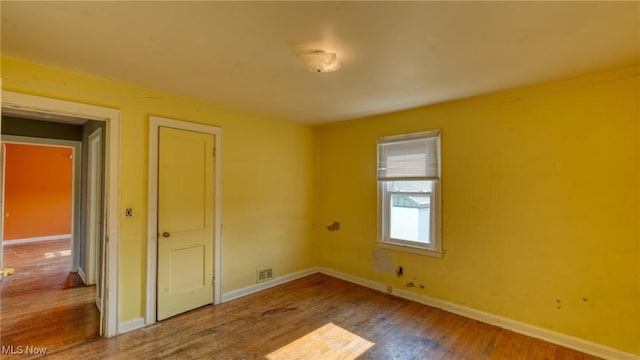 60 S Liberty St, New Concord, OH 43762 - empty room with wood finished floors and baseboards