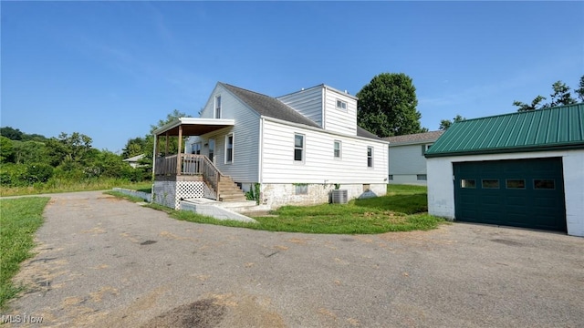 60 S Liberty St, New Concord, OH 43762 - view of property exterior with driveway and a cooling unit