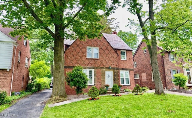 16721 Lomond Blvd, Shaker Heights, OH 44120 - view of front of home featuring a front yard and brick siding